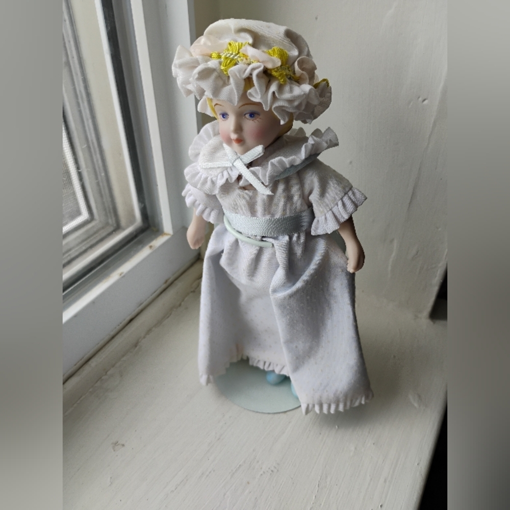 Avon Porcelain Doll with White Dress and Yellow Accents